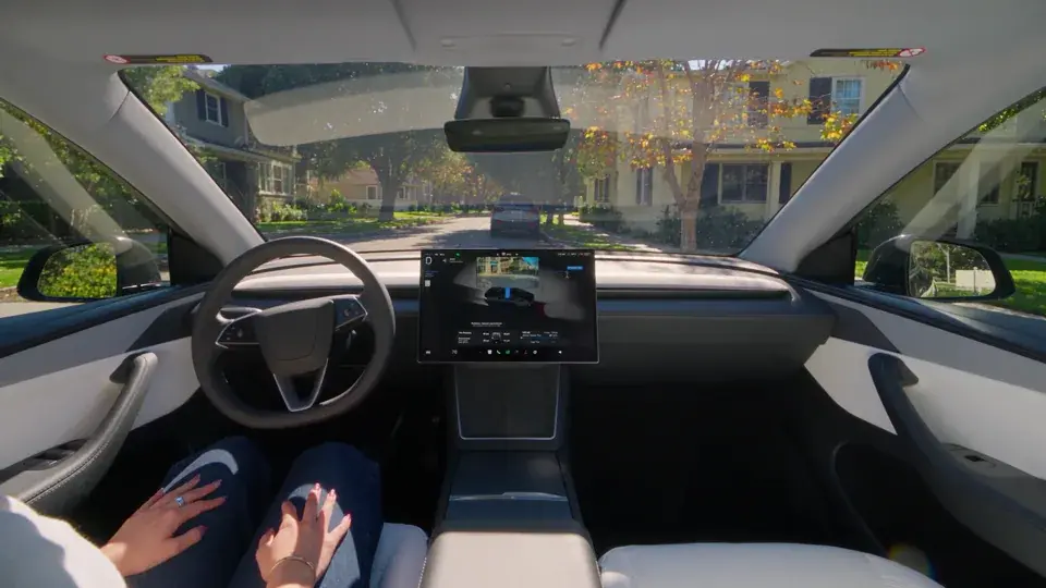 Inside a Tesla Model Y with the driver-assistance visualization on the touchscreen