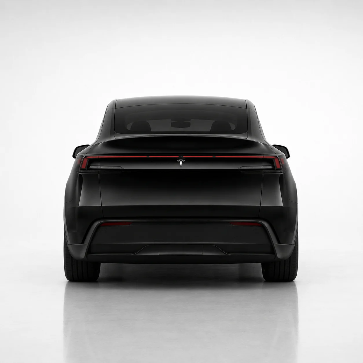 2026 Tesla Model Y rear studio view with full-width light bar
